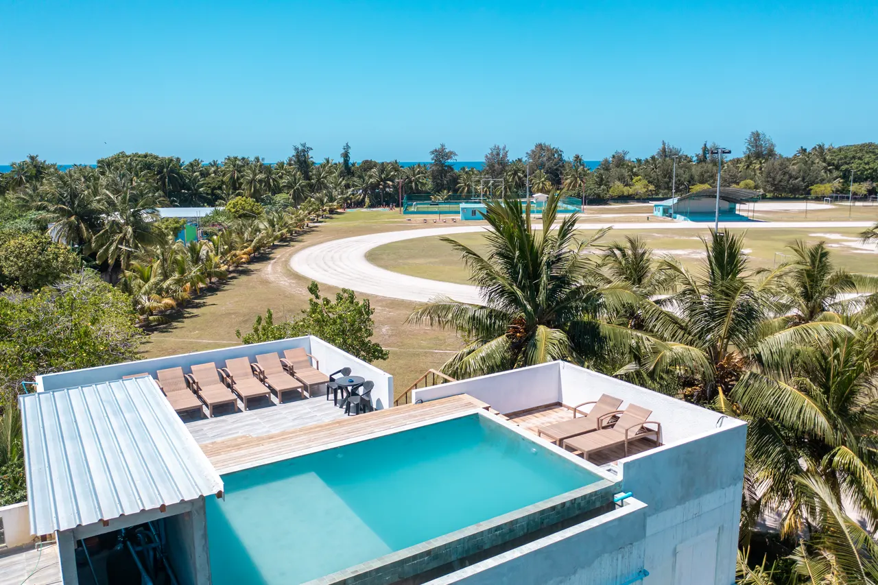 Rooftop pool and sun terrace at Cozy Roots on Fuvahmulah, seen from above