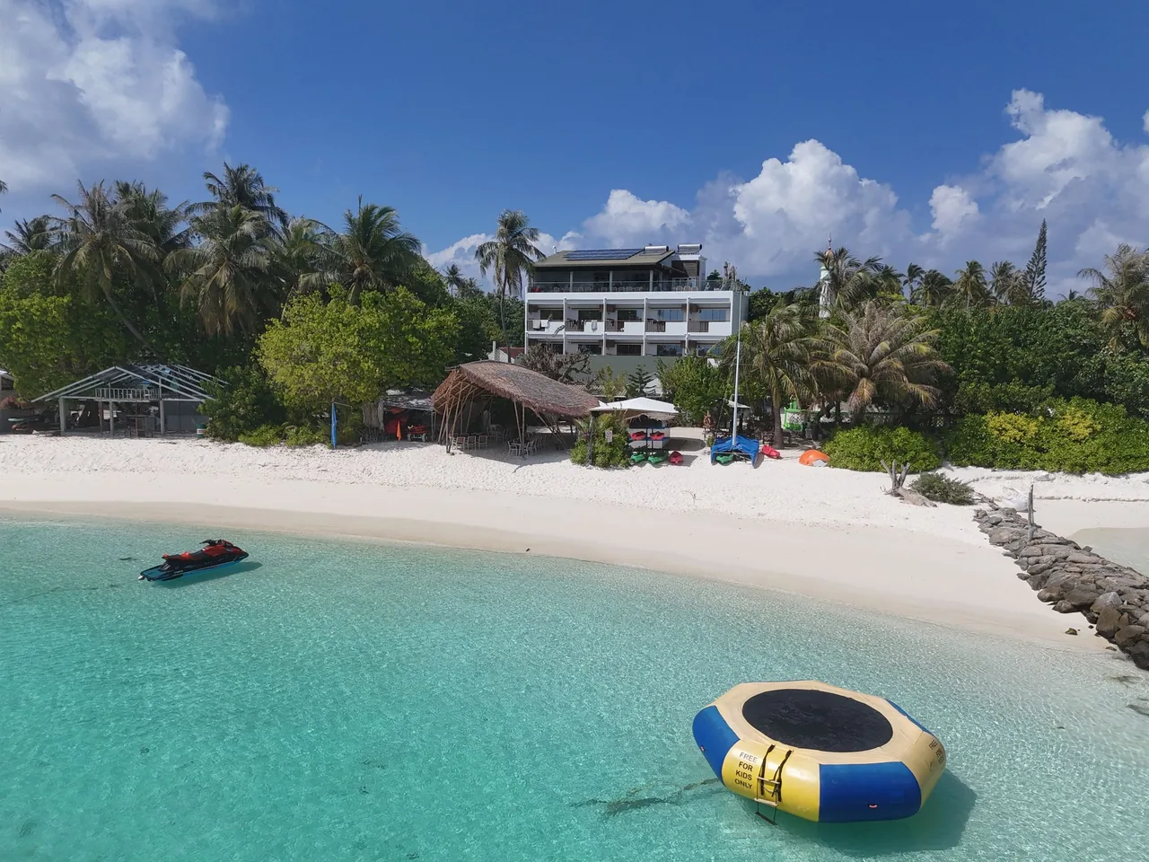 Aerial view of the beach and lagoon in front of Luau Beach Inn on Fulidhoo