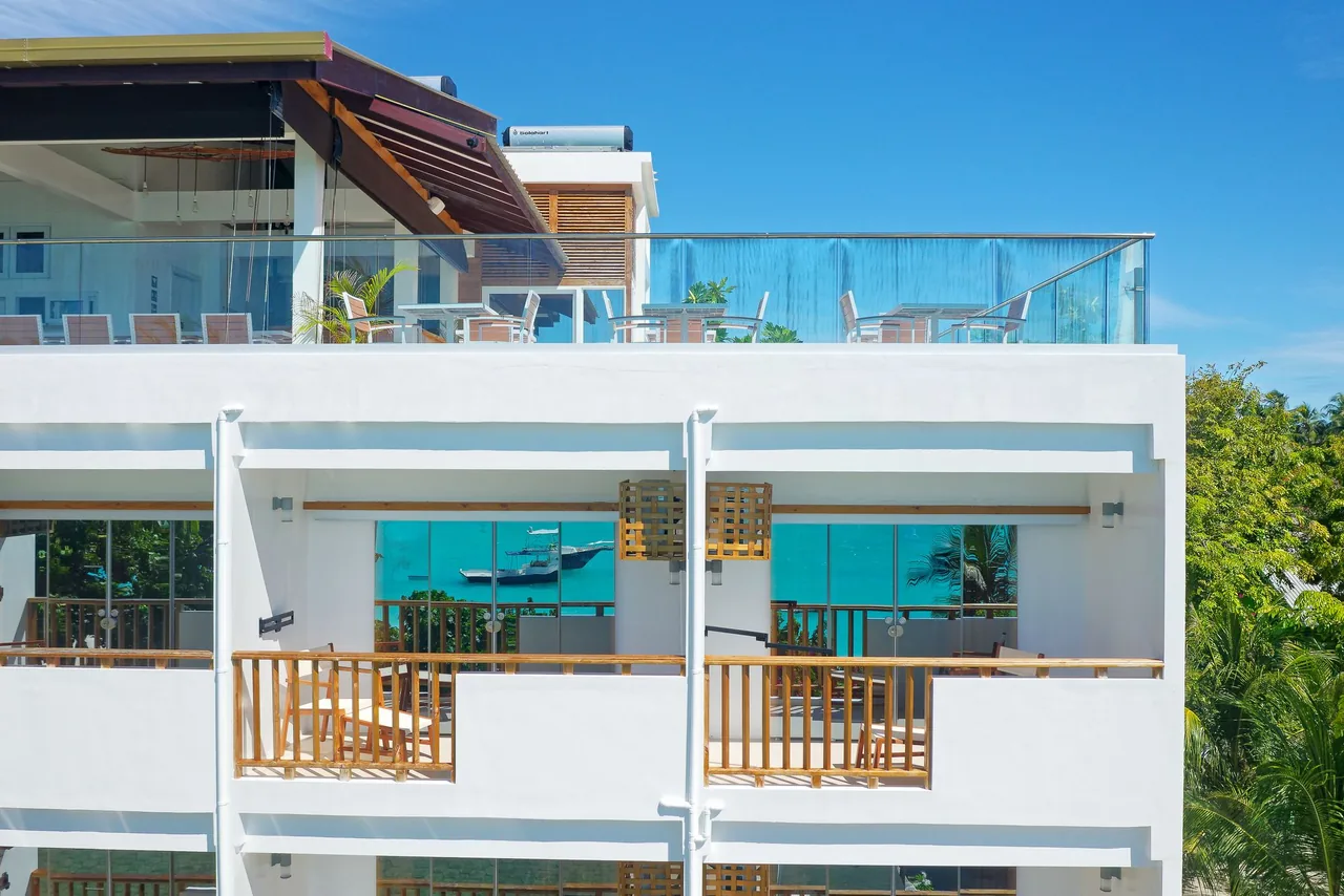 Balconies and rooftop terrace of Luau Beach Inn on Fulidhoo