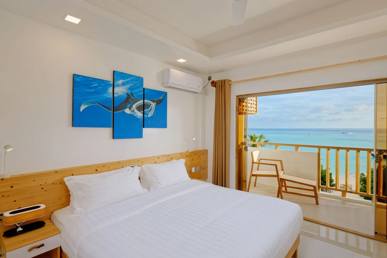 Deluxe Seaview room with a sea-view balcony at Luau Beach Inn