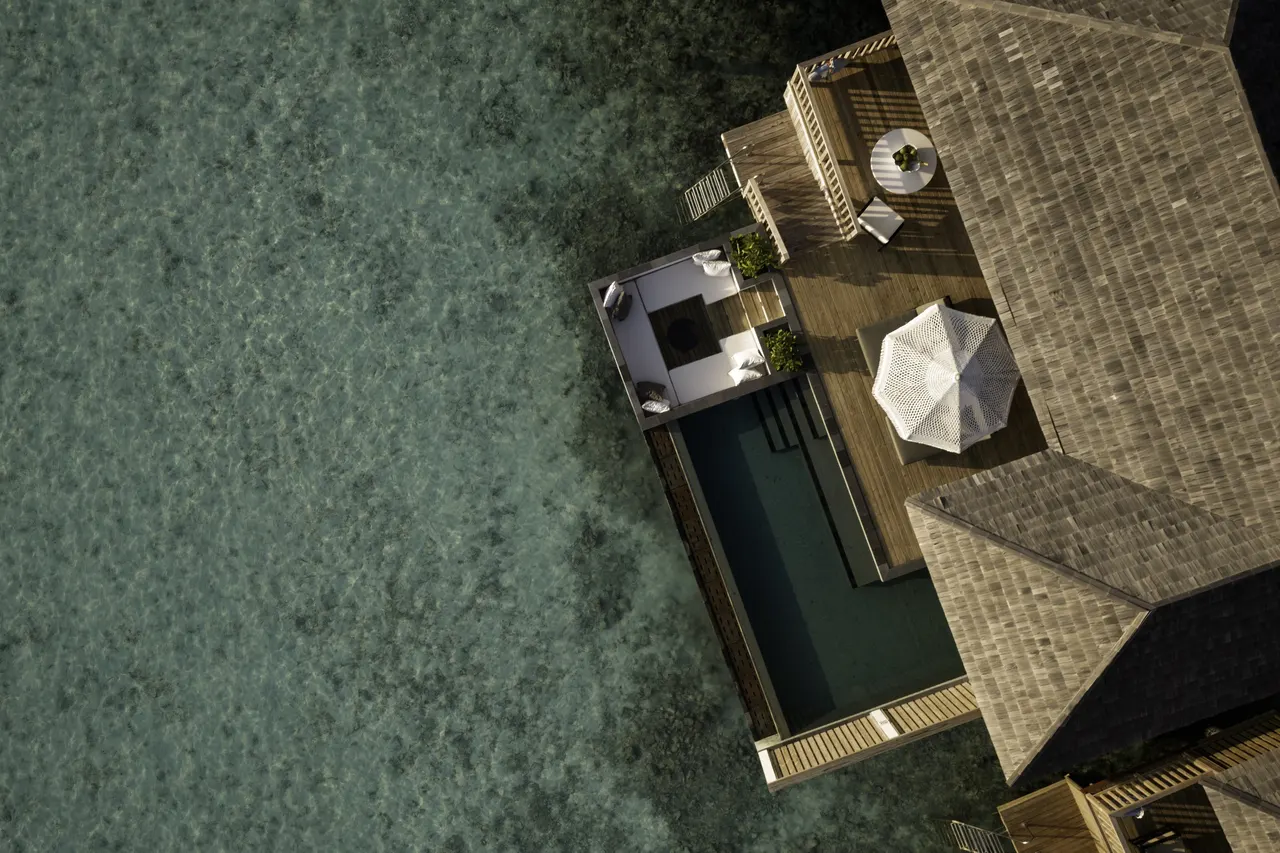 Sunset horizon water villa at Sun Siyam Iru Fushi, Maldives