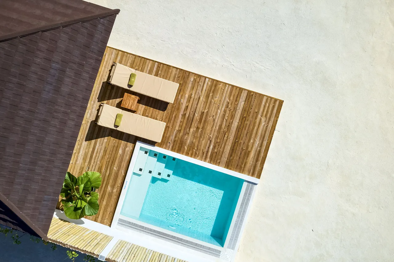 Grand beach villa pool aerial at Sun Siyam Olhuveli, Maldives